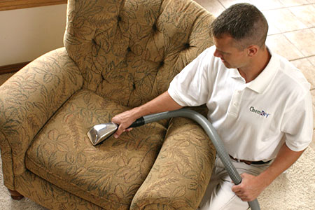 Chem-Dry technician cleaning upholstery